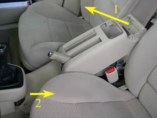 center console (where the shifter is). When the front of the e-brake console is free, slide the console up and over the e-brake handle.