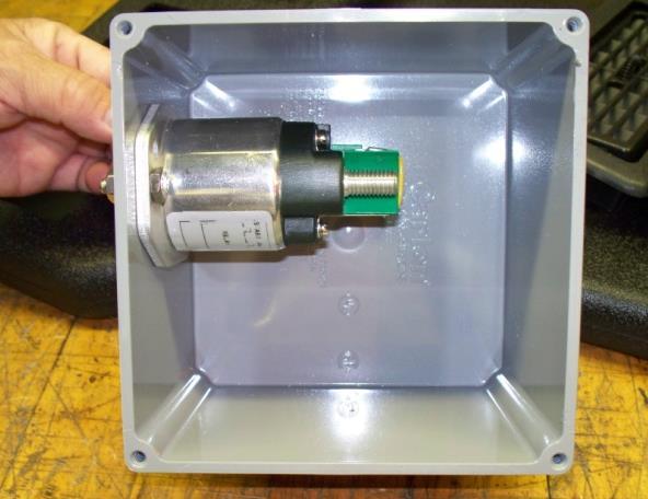 The separator will mount to the side of the box with 2 ¼ bolts and hardware. Drill large holes in the bottom of the box and route the cables through the holes to the separator.