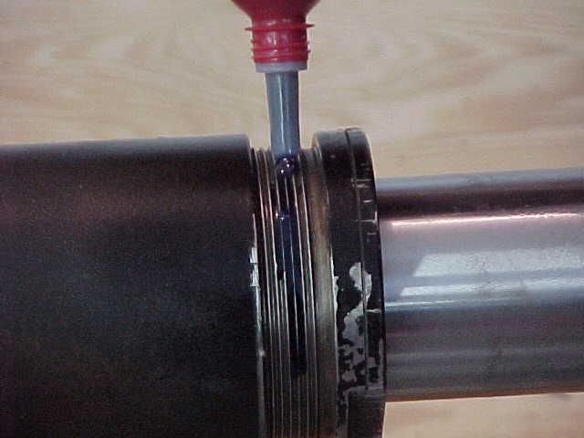 STEP 22 - THREAD THE ROD GUIDE INTO THE CYLINDER AND TIGHTEN UNTIL SNUG.