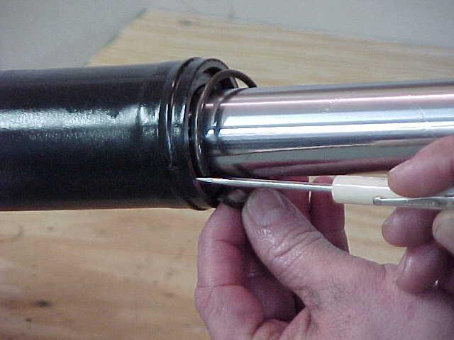 INSERT THE ROD ASSEMBLY BACK INTO THE CYLINDER.