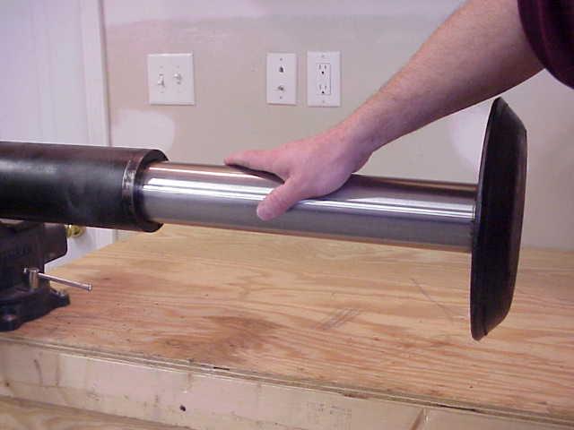 THIS WILL PREVENT REMAINING OIL IN THE CYLINDER FROM DRAINING OUT WHEN THE ROD IS