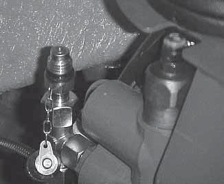 The pressures should never exceed those given in the section TECHNICAL SPECIFICATIONS in this Operator s and Safety Manual. Hydraulic steering valve - Remove the plug (a).