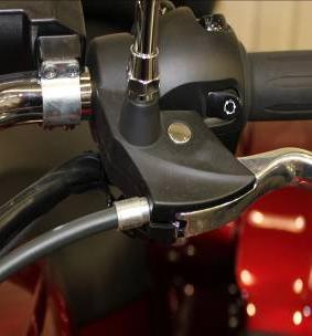 To remove the throttle cables from the twist grip, first remove the screws and the cover, then pull the