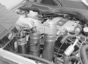 engine compartment. 7 is the reverse of removal ensuring the vacuum hoses are correctly reconnected.