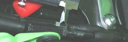 3. Slide the rubber protection off the cable adjusters (Figure 5). Loosen the nuts and shorten the adjusters (Figure 7).
