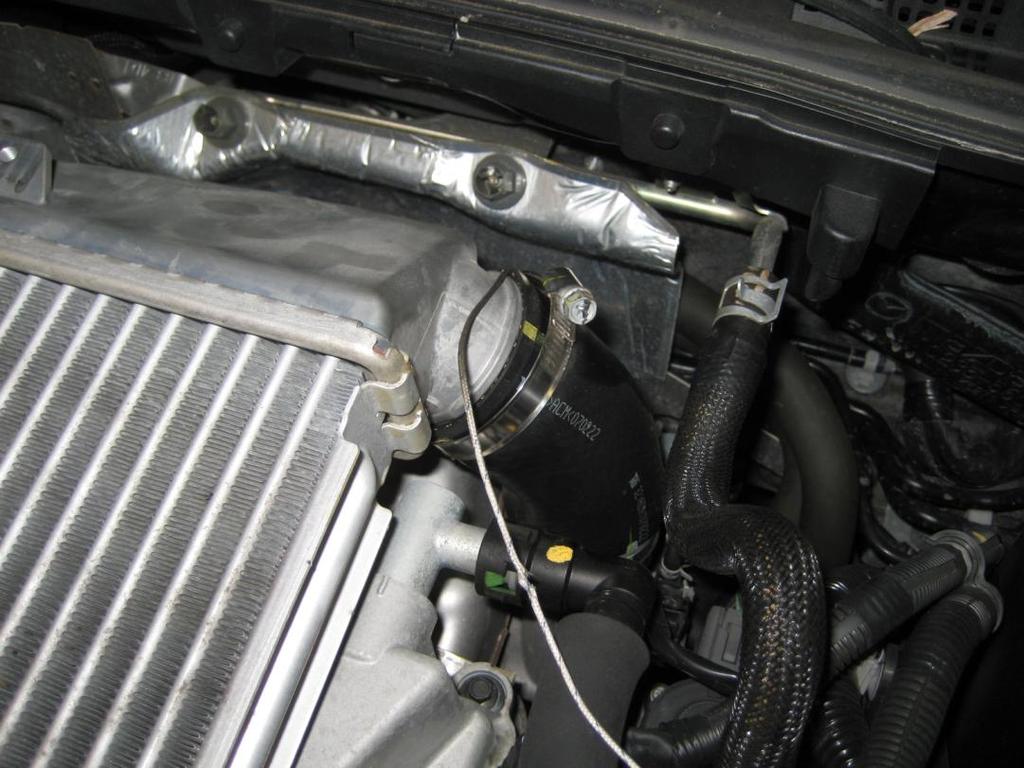 Open the bonnet and remove the two 10mm bolts holding the cover on to the