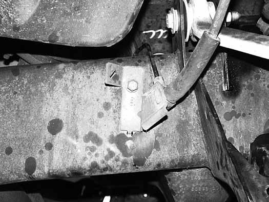 56. Passenger s side brake line: Remove the bolt retaining the line bracket to the frame (Fig 24).