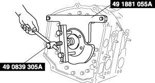 2. Remove the counterweight using the SST. 3. Remove the SST. Rear Oil Seal Removal Note 1.