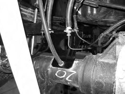 Attach ABS wires into the new bracket. Attach diff breather line to the axle breather stud. (Fig 29). FIG. 29 77.