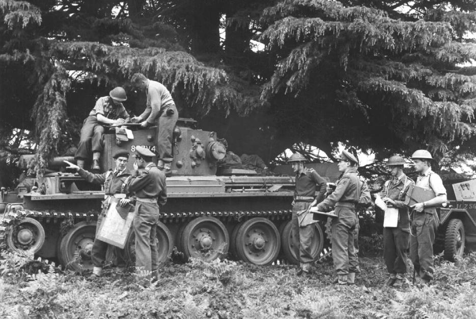 (Photo sourced from Sharpshooter House, Croydon) 3rd/4th CLY, orders group in front of a Cromwell tank