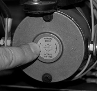 A standard 38" room will take approximately 45 seconds to retract. See the instructions below. Fig. 2 1. Remove protective label. (See Fig. 2). 2. Using a standard hex bit, insert into auxiliary drive device, i.