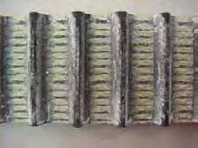 Abrasive Atmosphere Belts operating in abrasive atmospheres on applications like foundry shakers, taconite processing equipment, and