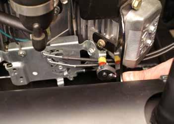 Remove the bottom cable clamp and disconnect the throttle