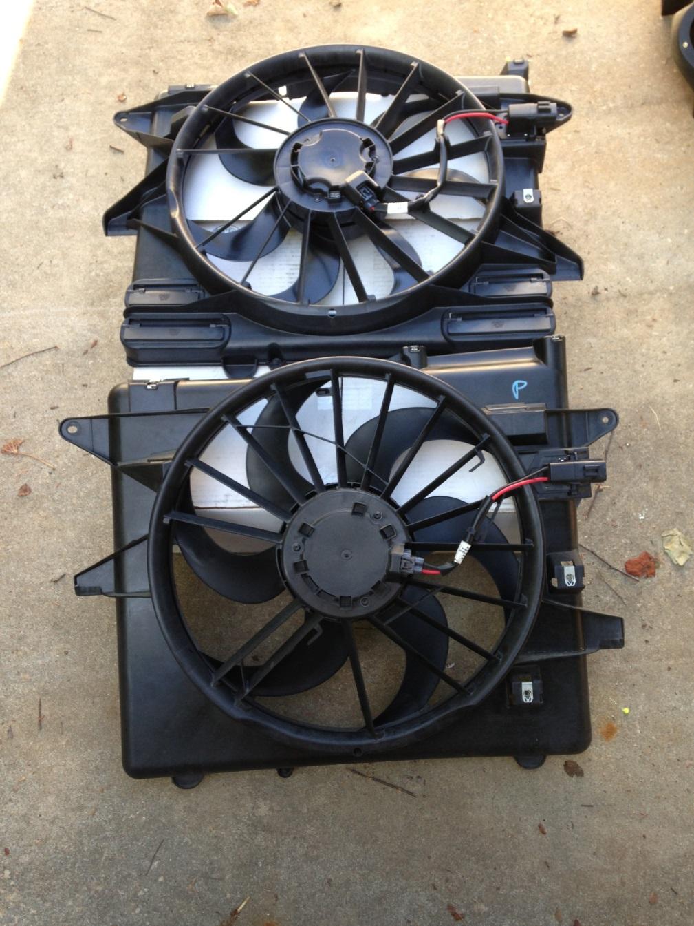 17. Remove the factory fan assembly by pulling it up, alternating between left and right until the fan clears the vehicle.