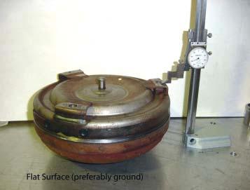 Defining a Quality Rebuilt Torque Converter With the drive hub on a flat surface, measuring the overall height of a torque converter can be done on a flat plate with a height gauge; not a carpenters