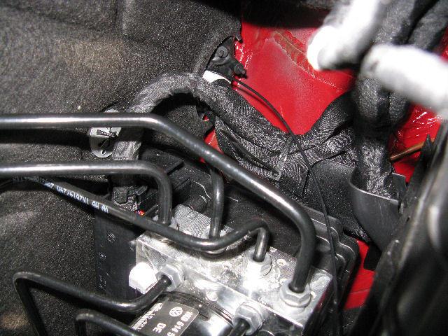 Cable hole. This is the view in the engine bay, just behind the battery.
