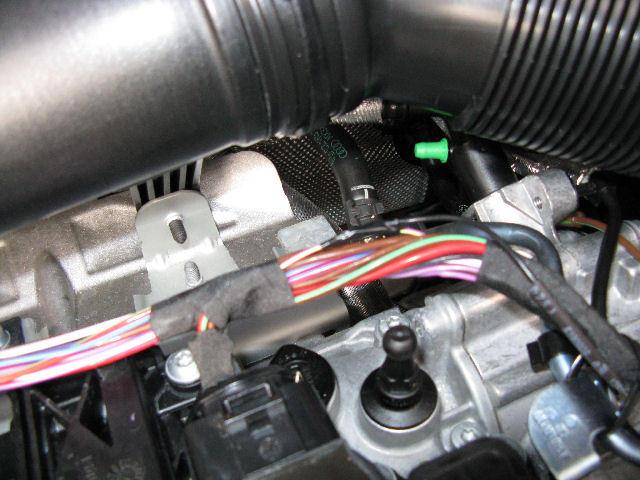 Route the wire from behind the battery, under the duct and to the closest coil. Cable tie at short intervals.