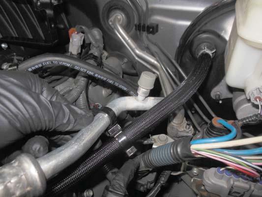 Then connect the other end of the brake booster hose to the center air tube of the