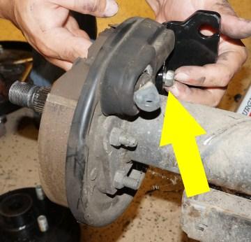 Remove the (2) bolts on the brake assembly connected to the brake
