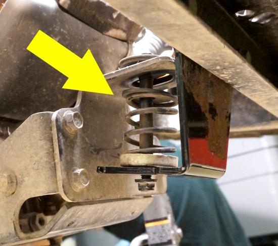 Place all washers, cap adapters and the compression spring in their original locations in relation to the front engine mount and the new engine mount bracket. Fasten the Original M10 Bolt and Nut.