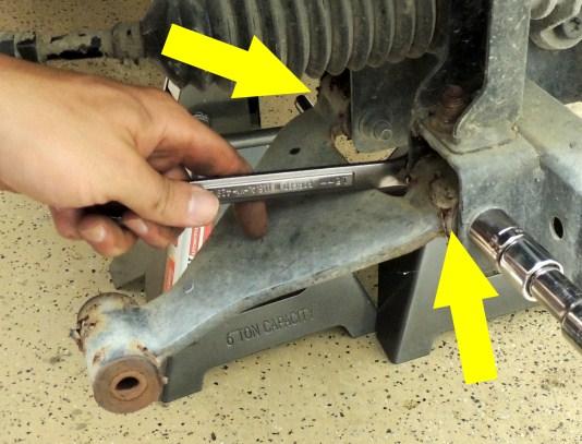 14. Remove the A-arms from the chassis by removing the (2) small bolts on each