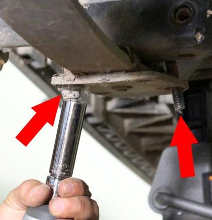 3. With the rear axle supported by the jack, disconnect the leaf spring at the rear shackle. Retain hardware. 4.