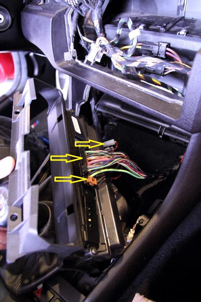 13. Carefully pull out the lower frame with attached cabling until you can reach the clips