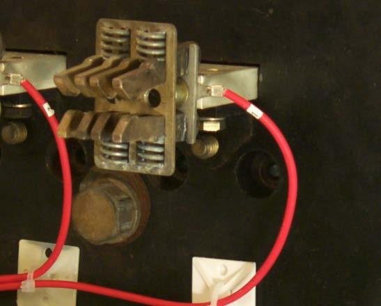 C. Insert each PT Wire Ring Terminal between the back of the Finger Clusters and the end on the Breaker Stabs as shown.