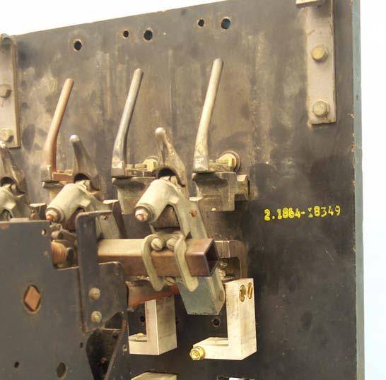 Using the four (4) original bolts removed in Step 2-J, loosely secure the Center Mechanism to the Breaker Backplate.