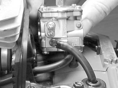 613GC SHOP MANUAL 12.5 Remove carburetor support screw (1) with #4 Torx or straight blade screwdriver. 12.6 Remove carburetor body screws (2). 12. CARBURETOR TITLE 12.7 Remove fuel line. 12.8 Remove pulse tube.