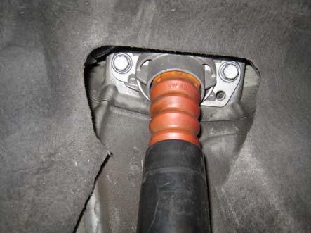 2. Using a floor or screw jack support the lower control arm, then, loosen and remove