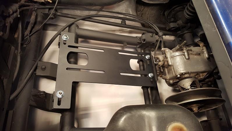 Place the engine plate over the OEM rubber mount studs and on top of the rear crossbeam.