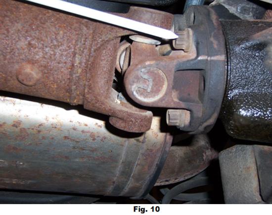11. Before removing the drive shaft, etch or scribe a mark on the mating parts to allow proper re-assembly as in Fig. 10.