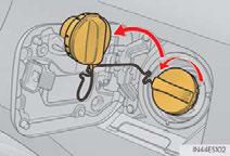 n Opening the fuel tank cap 1 Press the opener switch to open the fuel filler door.