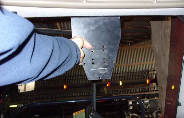 Display Installation 2. Position the bracket on the right-hand side of the cab. See Figure 5-3. Figure 5-3 Position Bracket on Cab s Right-hand Side 3. Secure the bracket with five screws.