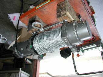 To fit winch into bar you must pack winch up on a bench to enable you to lower bar down on
