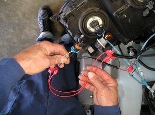 10. Scotch lock the red wire in between the fog light loom making sure the colour