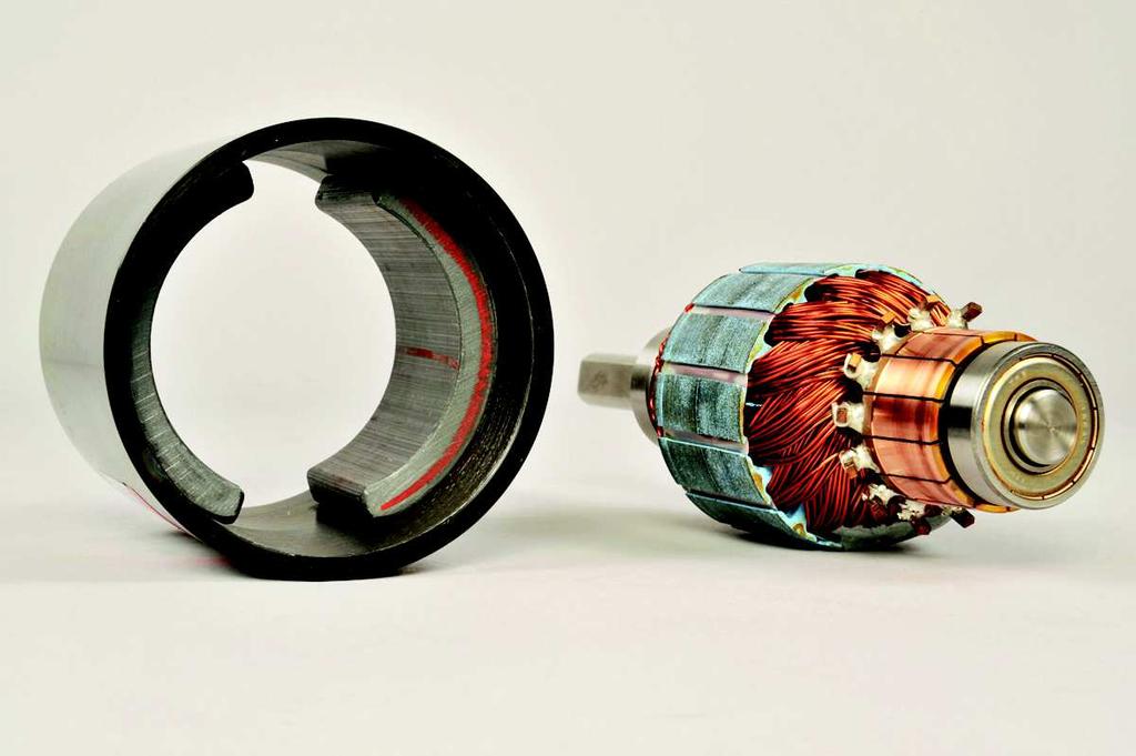 The stator consists of a pair of permanent magnets aligned so that poles of opposite polarities face each other.