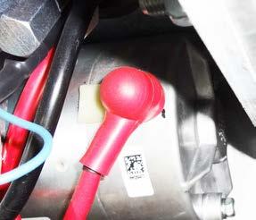 2. Install a red terminal protector (14) on a