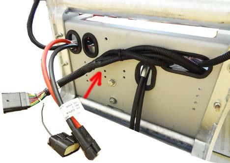 Plug the light harnesses to the lift frame harness (5) and secure them under the pump cover.