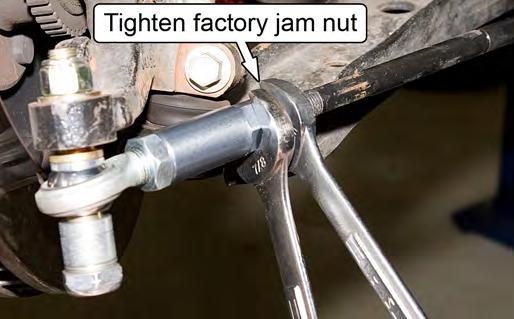 Tighten the factory tie-rod end jam nut against the MM Aluminum Adapter Sleeve to 41 ft-lb. 18. Tighten the outboard 5/8-18 jam nut securing the rod end to the MM Aluminum Adapter Sleeve to 41 ft-lb.