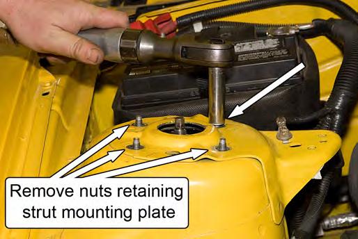 If using an aftermarket upper strut mount, mark its position to record the caster and the camber setting before removing the