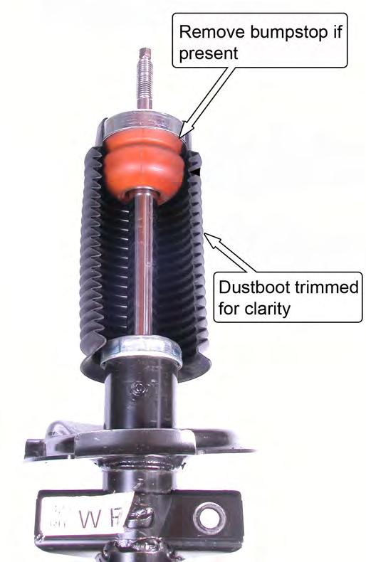 12. If your strut has an external bumpstop, located beneath the dust boot, remove the bumpstop now. 16. Remove the jack from the lower control arm. 17.