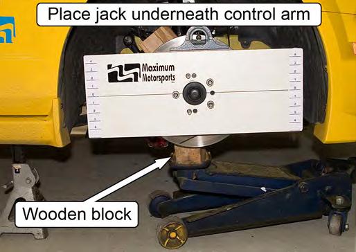 Place a jack underneath the front control arm and raise the spindle to normal ride height.