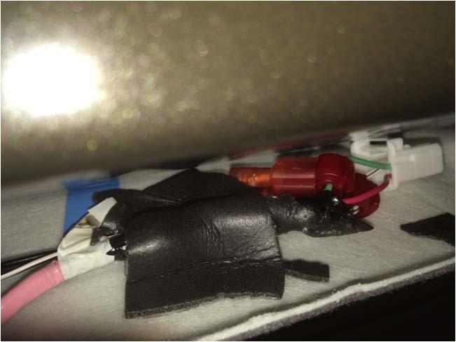 13. Secure the harness to the front center of the headliner with one (1) piece of foam tape. See figure 13. Figure 13 14. Connect the connectors.