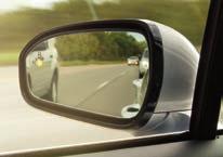 BLIS (Blind Spot Information System) with cross-traffic alert uses a light embedded in each sideview mirror 2 to warn of traffic detected in