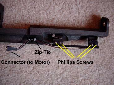 Using a Phillips screwdriver, remove the four (4) screws securing the limit switch unit to the motor assembly (Figure 3.44), cut the small zip-tie, and remove the limit switch unit. 5.