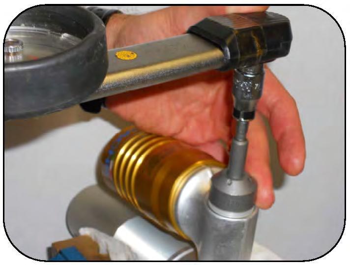 Tighten the compression adjuster assembly with the