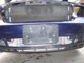 9) Back to the front bumper of the car, it is necessary to remove the aluminum support beam from the plastic cover.