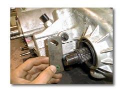 (b) Remove front yoke nut with 1-1/8" socket using an impact wrench. (Fig. 1) (3) Remove yoke. Note: If difficult, use a puller.
